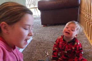 Lydia sings to her Down Syndrome brother Bo “you are my sunshine”.mp4