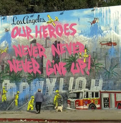 Artistas fazem mural em homenagem aos sobreviventes do devastador incêndio em Los Angeles